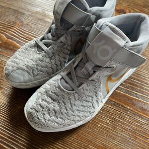 Nike Gray and Gold Sneakers with Mid-Top Design